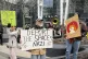 Protesters rally outside of a Tesla store in Boston, March 1