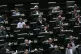 Iranian lawmakers sit in an open session of parliament for i