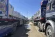 Trucks line up at the Egyptian side of the Rafah border cros