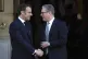 Britain's Prime Minister Keir Starmer (right) greets French 