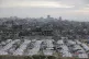 A tent camp for displaced Palestinians is set up amid destro