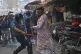 Policemen use batons to disperse supporters of the banned Is