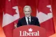 Liberal Leader Mark Carney smiles as he delivers his victory