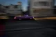A classic American car with tourists is driven at sunset alo