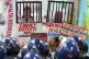 Activists hold a photo of former Philippine President Rodrig