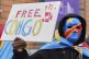 A pro-Congo demonstrator holds a sign outside of a meeting o