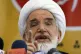 Iranian Shiite cleric Mehdi Karroubi gestures during a news 