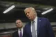 President Donald Trump talks to reporters as Richard Grenell