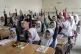Afghan school girls attend their classroom on the first day 