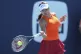 Emma Raducanu, of Great Britain, hits a return to Emma Navar
