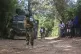 A Kenyan police officer patrols an area in the Kenscoff neig