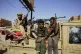 Soldiers arrive to the Allafah market, in an area recently r