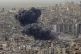 Smoke rises following an Israeli airstrike on Dahiyeh, in th