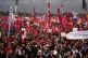 People listen to speeches during a rally called by Republica