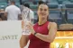Aryna Sabalenka lifts the Butch Buchholz trophy after defeat