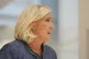 French far-right leader Marine Le Pen leaves the courtroom a