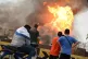Residents watch a fire in Putra Heights in central Selangor 