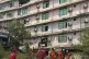 Rescuers carry the body of a victim, from a collapsed buildi