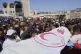 Mourners carry the bodies of Eight Red Crescent emergency re