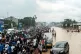 People walk through the flooded streets of Kinshasa, Democra
