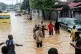 People walk through the flooded streets of Kinshasa, Democra