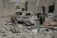 A Yemeni inspects the damage reportedly caused by US air str