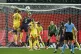 England's Leah Williamson jumps for the ball with Belgium's 