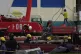 Workers prepare a crane on the third day of rescue efforts a