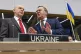 Britain's Defense Secretary John Healey, left, talks with Ge