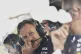Red Bull team principal Christian Horner sits on the pit wal
