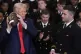 US President Donald Trump holds an American football during 
