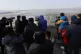 Visitors use binoculars to see the North Korea side from the
