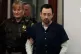 Former sports doctor Larry Nassar is accompanied by police i