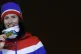 Norway’s Marit Bjoergen, gold, poses for photos during the medals ceremony for the women's 30k cross-country skiing at the closing ceremony of the 2018 Winter Olympics in Pyeongchang, South Korea, Sunday, Feb. 25, 2018. (AP Photo/Natacha Pisarenko)