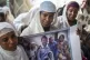 Members of Ethiopia's Jewish community hold pictures of thei
