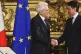 Italian President Sergio Mattarella (left) shakes hands with