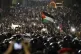 Jordanian protesters raise the flag during a demonstration o