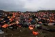 Piles of life jackets used by refugees and migrants lie at a