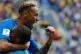 Brazil's Neymar celebrates with teammate Douglas Costa
