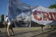 Protesters carry a banner showing Israeli Prime Minister Ben