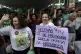 Environmental activist holds a sign with a message that read