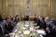 France's President Emmanuel Macron (right) attends a meeting