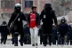 Police detain a supporter of former President Evo Morales du