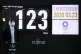 A man stands in front of a countdown display for the Tokyo 2