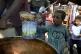 A displaced child lines up for food distribution in Deir al-