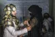 An Afghan woman is checked by a nutritionist at a clinic run