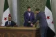 Syria's interim president Ahmad Al-Sharaa (centre) prepares 