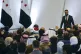 Syria's interim president Ahmad al-Sharaa (right) leaves the