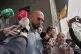 Andrew Tate speaks to media outside the Directorate for Inve