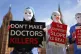 Campaigners protest outside Parliament in Westminster, Londo